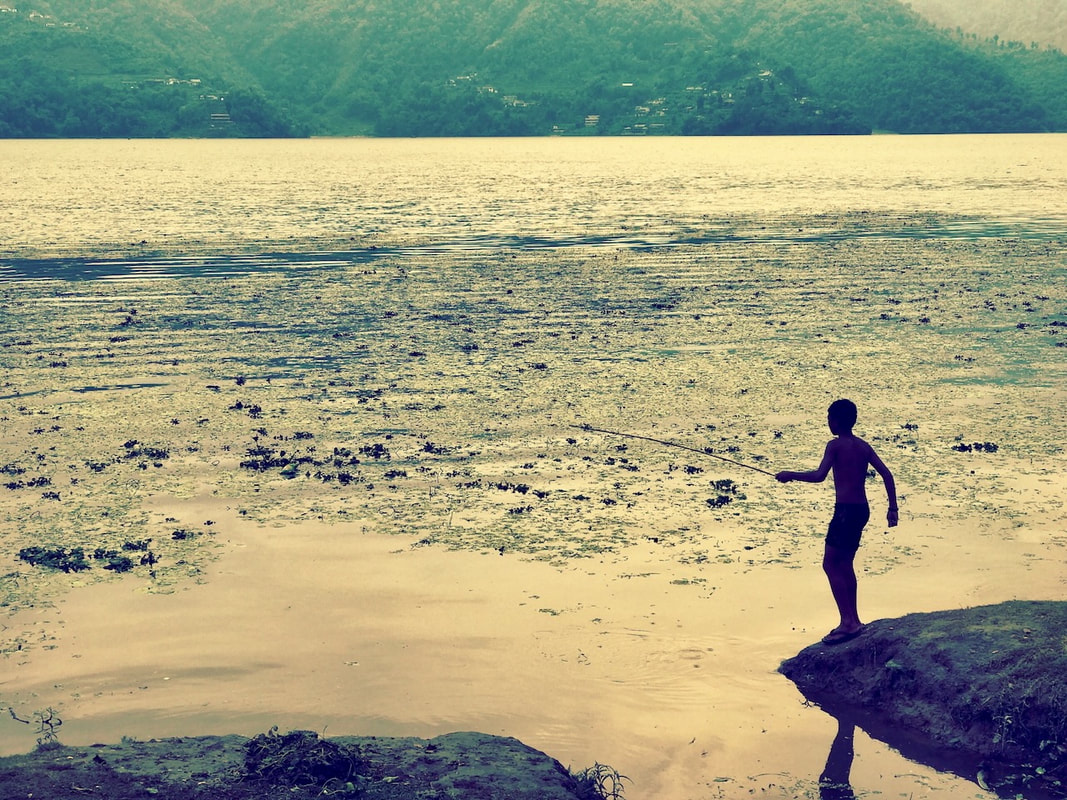 Boy Fishing Nepal - God Dieux Photography