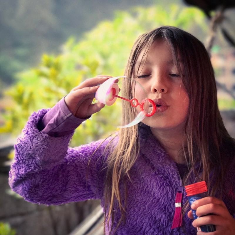 A Friend blows a bubble - God Dieux Photography