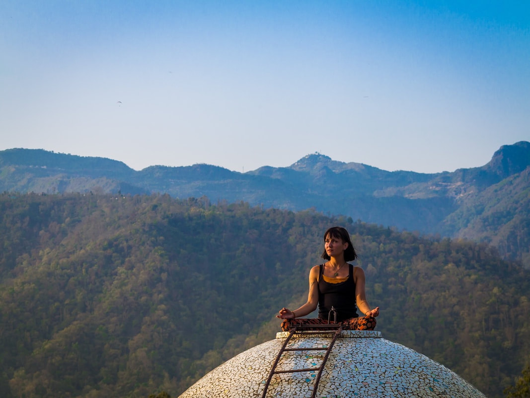 Woman on top of the Beatles Ashram in Rishikesh India - God Dieux Photography