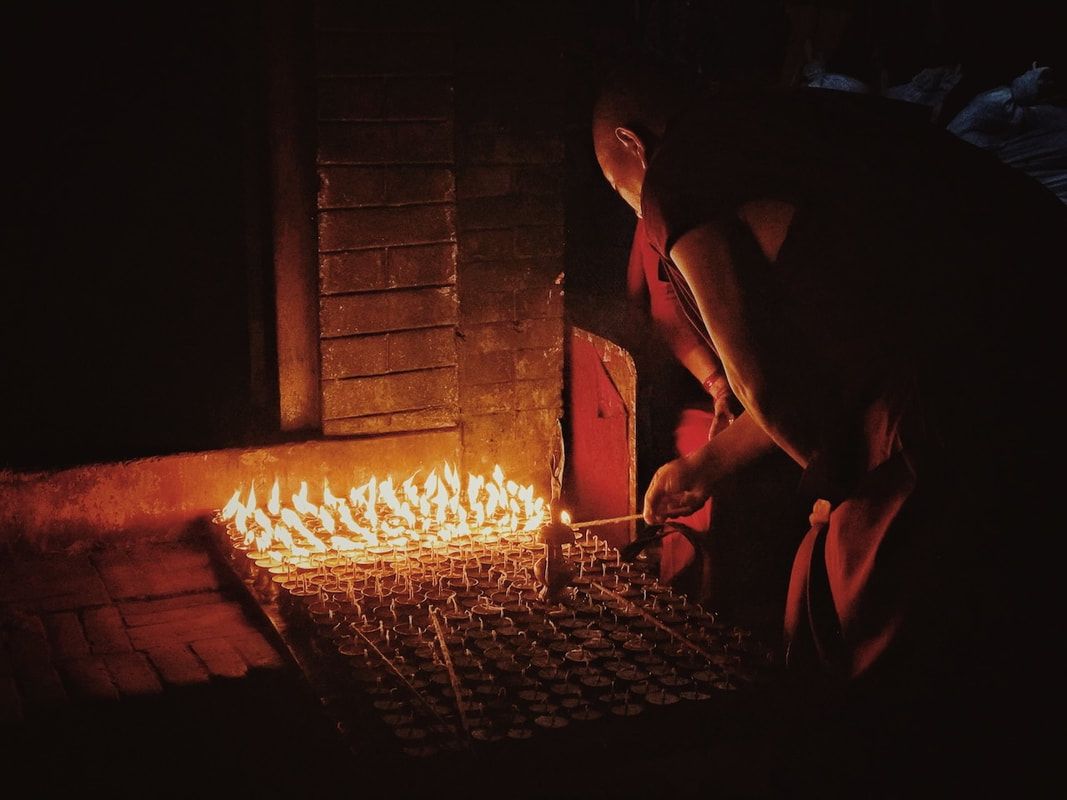 God Dieux Photography - Tibetan Monk in Kathmandu with Candles